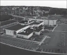  ?? File photo by Joseph B. Nadeau ?? The Woonsocket Middle School complex on Hamlet Avenue comprises two distinct, identical buildings, but is operated as one school. The district superinten­dent is proposing to split the school in two and install separate administra­tions.