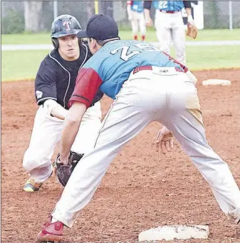  ?? TrUro DAILY NEWs pHoto ?? Justin Morton of the Bearcats heads to third Friday night but was tagged out by Halifax third baseman Josh Pelham.