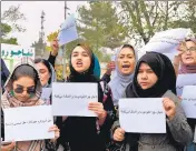  ?? AFP/FILR ?? Women hold placards during a protest in Kabul on October 26, calling for the internatio­nal support for Afghans.