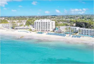  ??  ?? The quiet bay in front of the Sea Breeze Beach House in Barbados is perfect for swimming and boogie boarding.