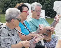  ?? PHOTO: JARED MORGAN ?? Strum sisters . . . Alexandra women (from left) Judy Guise, Heather Trainor and Rosie Henderson play ukuleles at the final day of the Lauder Ukulele Festival.