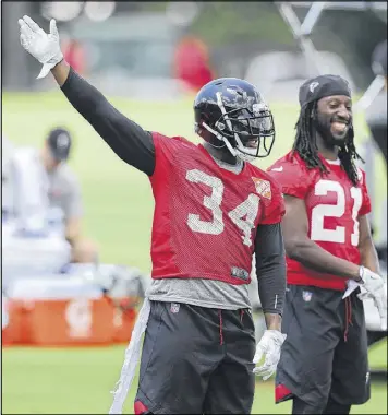  ?? CURTIS COMPTON / CCOMPTON@AJC.COM ?? Brian Poole (left, with Desmond Trufant during the first day of minicamp Tuesday) is expected to start for the Falcons this season and see playing time at cornerback and safety — “wherever the team needs me,” he said.