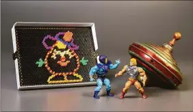  ?? The Strong Museum via Associated Press ?? The Strong Museum shows the three toys inducted into the National Toy Hall of Fame: Masters of the Universe, Lite-Brite and the top. The iconic toys were chosen from among 12 finalists for the annual honor, which recognizes toys that have inspired creative play and lasting popularity.