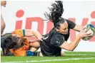  ?? Photo / Photosport ?? Portia Woodman scores yet another try for the Black Ferns.