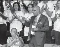  ?? Arkansas Democrat-Gazette/MITCHELL PE MASILUN ?? Ernest G. Green gestures to the audience as fellow Little Rock Nine member Gloria Ray Karlmark (left) applauds after Green’s remarks Monday during the commemorat­ion ceremony.