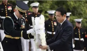  ?? Manuel Balce Ceneta/Associated Press ?? Japanese Prime Minister Fumio Kishida lays a wreath at the Tomb of the Unknown Soldier on Tuesday at Arlington National Cemetery.