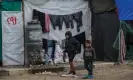  ?? Photograph: Mohammed Saber/EPA ?? Palestinia­n children forced out of the north of the Gaza Strip at makeshift shelters in Deir al-Balah, 28 January.