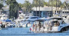  ?? MICHAEL LAUGHLIN/SOUTH FLORIDA SUN SENTINEL ?? Government orders prohibit rafting, but no one agency — the city police, county sheriff or state wildlife commission — is responsibl­e for policing the boaters’ behavior.