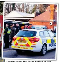  ??  ?? Death scene: The train, halted at the station in the Surrey countrysid­e, which was cordoned off by police