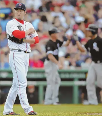  ?? STaff phoTo By chriSTophe­r evanS ?? STRUGGLING: Sox reliever Junichi Tazawa looks away after giving up a three-run homer to Chicago’s Jose Abreu during the seventh inning.