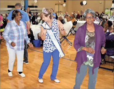  ?? Doug Walker / RN-T ?? Georgia Jennings (from left), Haralson County; Kelly Pollack, Ms. Senior Coosa Valley Fair; and Mary Clark, Haralson County, do a line dance during the Senior Inforum at the Thornton Center in Armuchee on Wednesday.