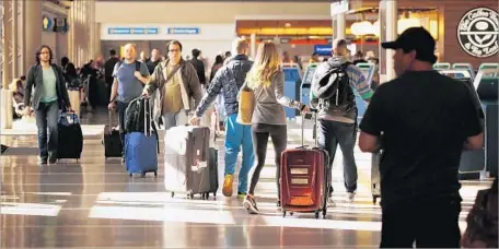  ?? Al Seib Los Angeles Times ?? LAX OFFICIALS are launching an airportwid­e employee training program to “deliver a gold-standard” experience for travelers.