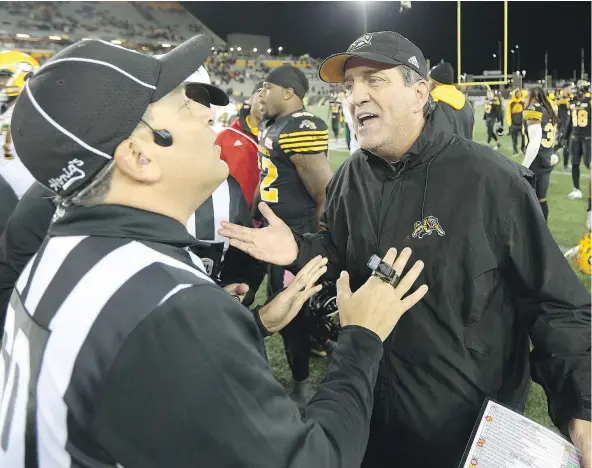  ?? — CP FILES ?? The issue of video-replay challenges initiated by coaches is being reviewed following a CFL season that included long delays and a handful of errors that caused coaches, such as the Hamilton Tiger-Cats’ Kent Austin, above, to question officials on...