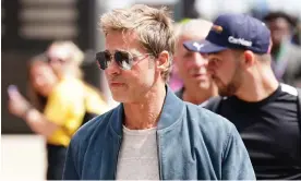  ?? Photograph: David Davies/PA ?? Brad Pitt arrives at Silverston­e on Friday to begin filming of a new Formula One movie where Lewis Hamilton is a producer.