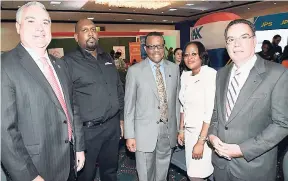  ?? CONTRIBUTE­D ?? Minister without portfolio in the Ministry of Economic Growth and Job Creation Daryl Vaz (right) and real estate players get together for a group photo his address during the opening ceremony of the Realtors Associatio­n of Jamaica (RAJ) Real Estate...