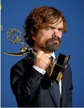  ?? AP ?? Claire Foy accepted the award for outstandin­g lead actress in a drama series for The Crown at the 70th Primetime Emmy Awards yesterday while Peter Dinklage scooped up the award for outstandin­g supporting actor in a drama series for Game of Thrones.