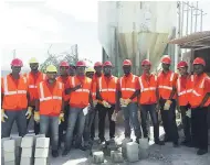  ??  ?? Jamaica College boys on site at Gore Developmen­t’s New Harbour Village constructi­on in St Catherine during the summer holidays as part of their first Constructi­on Project Management Course.