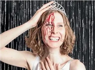  ?? SUPPLIED ?? Telia Nevile signs off her emails with a giant photo of herself sporting a crown with blood splatters down her face.