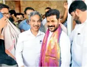  ?? — DC ?? Telangana PCC chief A. Revanth Reddy with his followers at his residence in Hyderabad on Sunday.