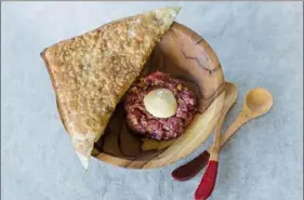  ?? Asia Coladner ?? Chef Simone Tong will feature beef tartare as the second course at the Chinese New Year dinner at Superior Motors in Braddock on Feb. 5.