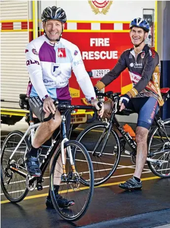  ?? Photo: Nev Madsen ?? RESEARCH RIDE: Kitchener Street station firefighte­rs Stewart Lange (left) and Graham Horchner are headed to the Gold Coast before setting off on the Bikes4Burn­s challenge.