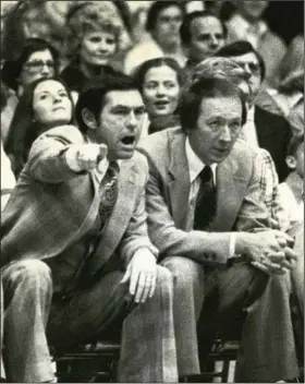  ?? (Arkansas Democrat-Gazette file photo) ?? Former Arkansas coach Eddie Sutton (left), who died last week, coaches during a game in 1979 at Barnhill Arena in Fayettevil­le. In 11 seasons coaching the Razorbacks, Sutton was 120-8 at Barnhill.