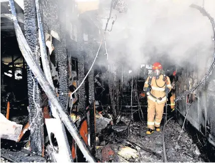  ??  ?? > A firefighte­r inside Sejong Hospital after a fire left 37 people dead yesterday