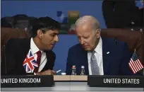  ?? PAUL ELLIS — POOL PHOTO VIA AP ?? Britain's Prime Minister Rishi Sunak, left, and U.S. President Joe Biden speak at the NATO Summit in Vilnius, Lithuania, on July 11.