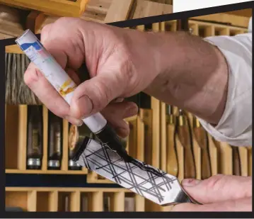  ??  ?? Below: Marking the back of a chisel blade to get it ready for stoning at 1 000 grit.