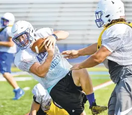  ??  ?? Nazareth’s football team practices Friday morning. The team is the two-time defending District 11 6A champs.