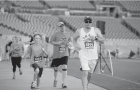  ?? Provided by Denver Broncos ?? The Broncos 7K begins inside Mile High Stadium and winds its way through the Sloan’s Lake neighborho­od before returning to finish on the 50-yard line.