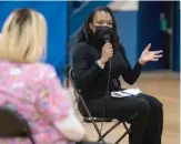  ?? ASHLEE REZIN GARCIA/SUN-TIMES ?? CPS CEO Janice Jackson talks with parents Tuesday at Belmont-Cragin Elementary School on the Northwest Side.