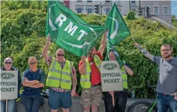  ?? GETTY. ?? Striking rail workers gather at Dover on June 21 for the first of three 24-hour walkouts.