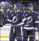  ?? Chris O’Meara The Associated Press ?? Tampa Bay centers Steven Stamkos, left, and J.T. Miller leave the ice after losing 4-2 to Washington in Game 1 of the Eastern Conference Final on Friday.