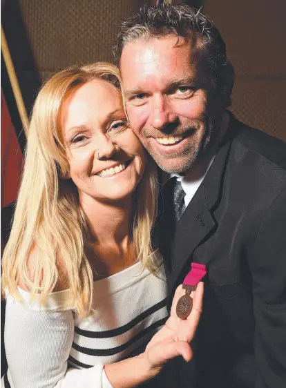  ?? LOCAL HERO: Steven Morris and his wife Sharon with his award for bravery. Picture: SCOTT RADFORD- CHISHOLM ??