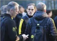  ?? MARTIN MEISSNER — THE ASSOCIATED PRESS FILE ?? In this file photo Dortmund head coach Thomas Tuchel stands outside the team bus after it was damaged in an explosion.