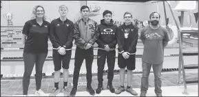  ??  ?? Above left: Manuel Castillo makes his way through the pool while performing the butterfly stroke. Above right: Members of the Big Spring Steer swim team and coaching staff pose together after the meet.
By SHAWN MORAN