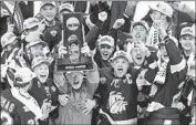  ?? Andy Clayton-King Associated Press ?? MINNESOTA DULUTH celebrates after winning its second NCAA hockey championsh­ip.