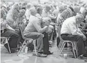  ??  ?? People pray during the Southern Baptist Convention in St. Louis. The SBC has 15.3 million members.