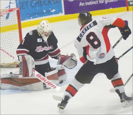  ?? FILE PHOTO ?? Crushers forward Kyle Carter looks for a rebound on goaltender Tanner Somers in this Nov. 17 game against Miramichi.