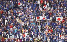  ?? Reuters ?? ■ Japan fans celebrate after the match at the Khalifa Internatio­nal Stadium, Doha.