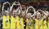  ?? TERTIUS PICKARD — THE ASSOCIATED PRESS ?? Sweden players celebrate with their bronze medals after beating Australia in the Women's World Cup third-place game.