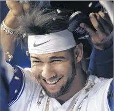  ?? CP PHOTO ?? Toronto Blue Jays’ Lourdes Gurriel Jr. gets a sunflower seed shower in the dugout after hitting a solo home run against the Tampa Bay Rays in the first inning of their American League MLB baseball game in Toronto on Friday.