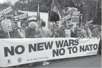  ??  ?? Supporters take part in the “No to Nato” protest march in Newport, south Wales, on Saturday. Around 1,000 protesters marched through the streets of Newport ahead of next week’s Nato summit.