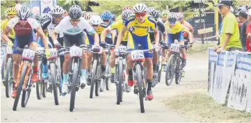  ??  ?? Team Kazakhstan’s Kiril Kazantsev (middle) and Japan’s Yu Takenouchi (left) at the start of the Asia MTB Series’ men’s XCO race at Tambunan, Sabah on Saturday.