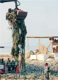  ?? Supplied photo ?? The waste extracted from the sea included three fishing boats, tyres and old fishing nets. —