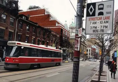  ?? ANDREW FRANCIS WALLACE/TORONTO STAR FILE PHOTO ?? To accommodat­e drop-offs and deliveries, accessible loading zones have been added on most blocks along King St.