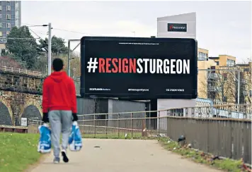  ??  ?? A digital billboard displayed in Glasgow: after years in office, the SNP, now led by Nicola Sturgeon, has become tired and self-serving