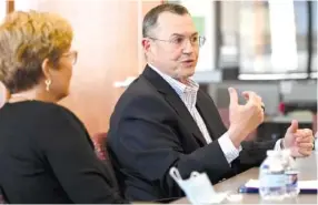  ?? STAFF PHOTO BY ROBIN RUDD ?? Vicky Gregg, left, and Jim Coleman, of the Erlanger Health System board, visited the Chattanoog­a Times Free Press on Feb. 18. The board Thursday voted to offer Coleman the position of CEO of the health system.