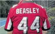  ??  ?? A Vic Beasley jersey is just part of superfan Cindy Lacey’s voluminous assortment of Falcons gear.